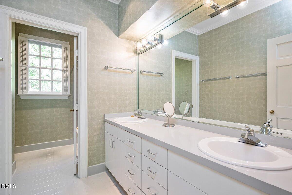 512 Hertford Street Raleigh, NC 27609 - Photo 22 of 39 a bathroom with a double vanity sink mirror and double