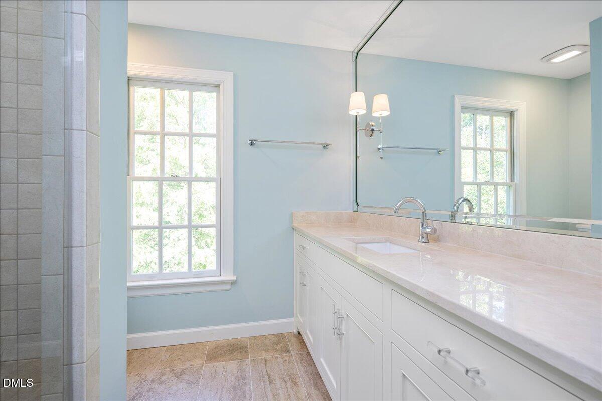 512 Hertford Street Raleigh, NC 27609 - Photo 28 of 39 a bathroom with a sink and a mirror