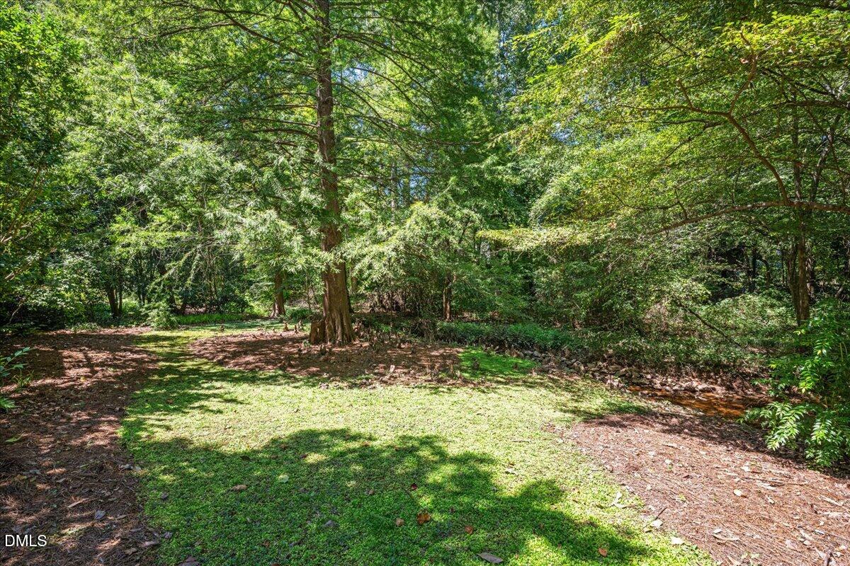 512 Hertford Street Raleigh, NC 27609 - Photo 34 of 39 a view of outdoor space with trees all around
