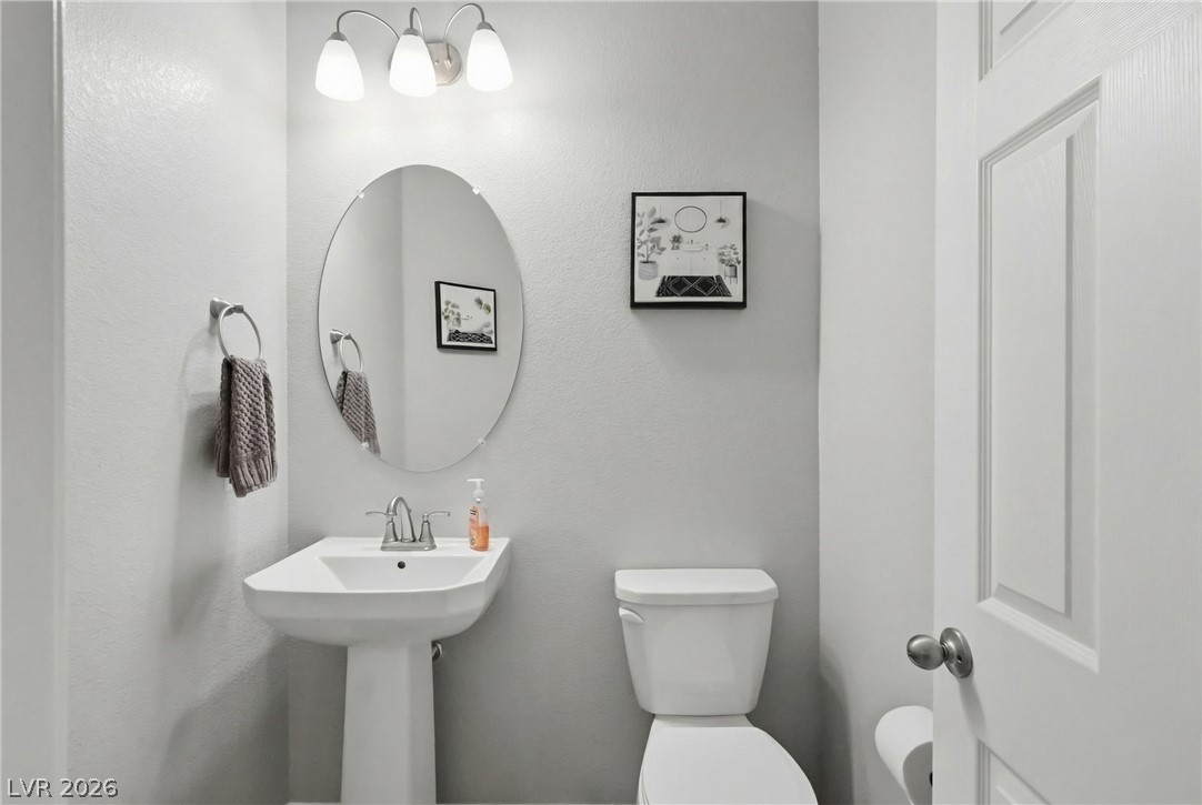 1921 Miller Ridge Avenue North Las Vegas, NV 89031 - Photo 10 of 26 A well-appointed bathroom offers modern fixtures and a clean design.