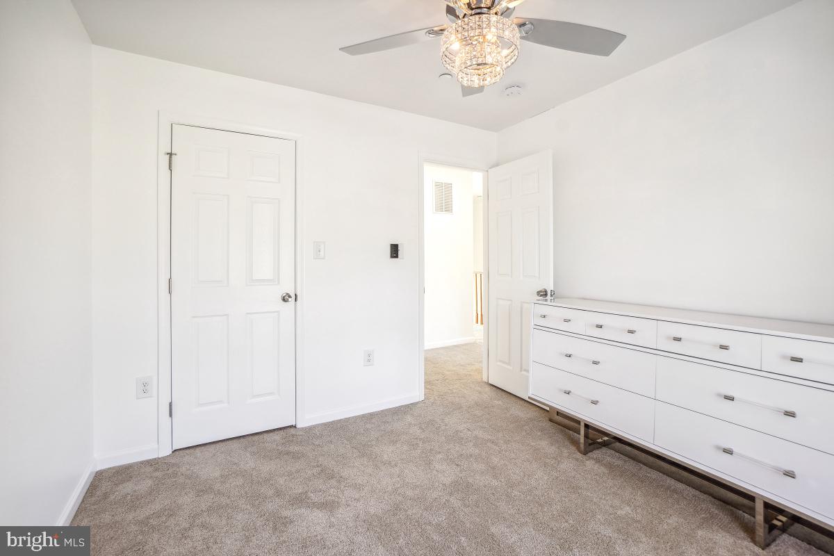 575 Primus Court Frederick, MD 21703 - Photo 13 of 31 a view of room with cabinet and ceiling fan
