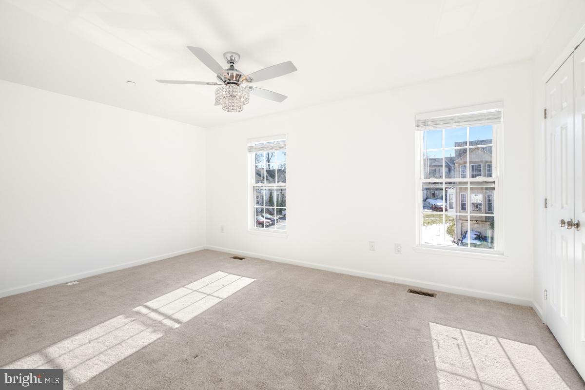 575 Primus Court Frederick, MD 21703 - Photo 15 of 31 an empty room with windows and fan