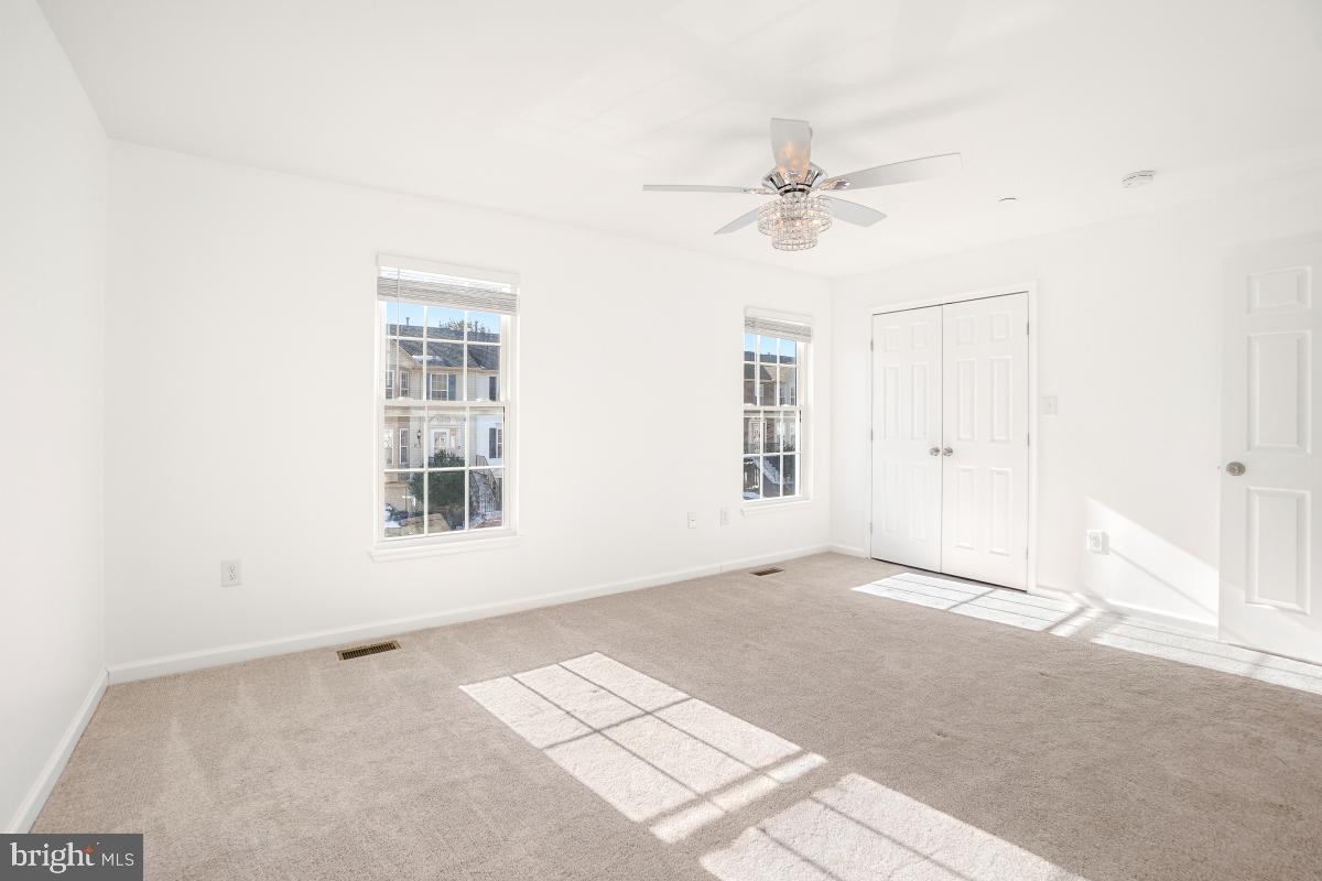 575 Primus Court Frederick, MD 21703 - Photo 16 of 31 an empty room with windows and fan