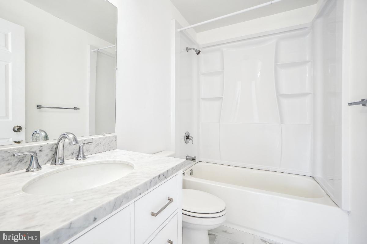 575 Primus Court Frederick, MD 21703 - Photo 18 of 31 a bathroom with a sink toilet and shower