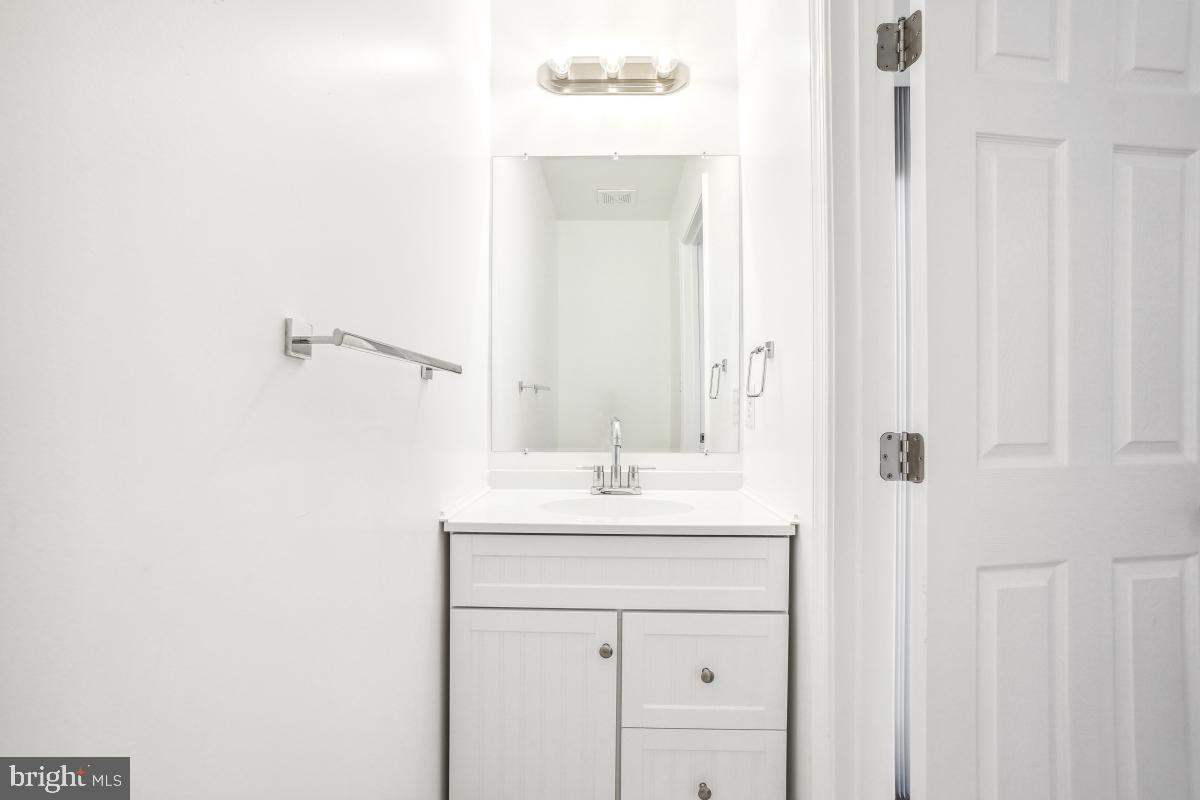 575 Primus Court Frederick, MD 21703 - Photo 19 of 31 a bathroom with a sink and a mirror