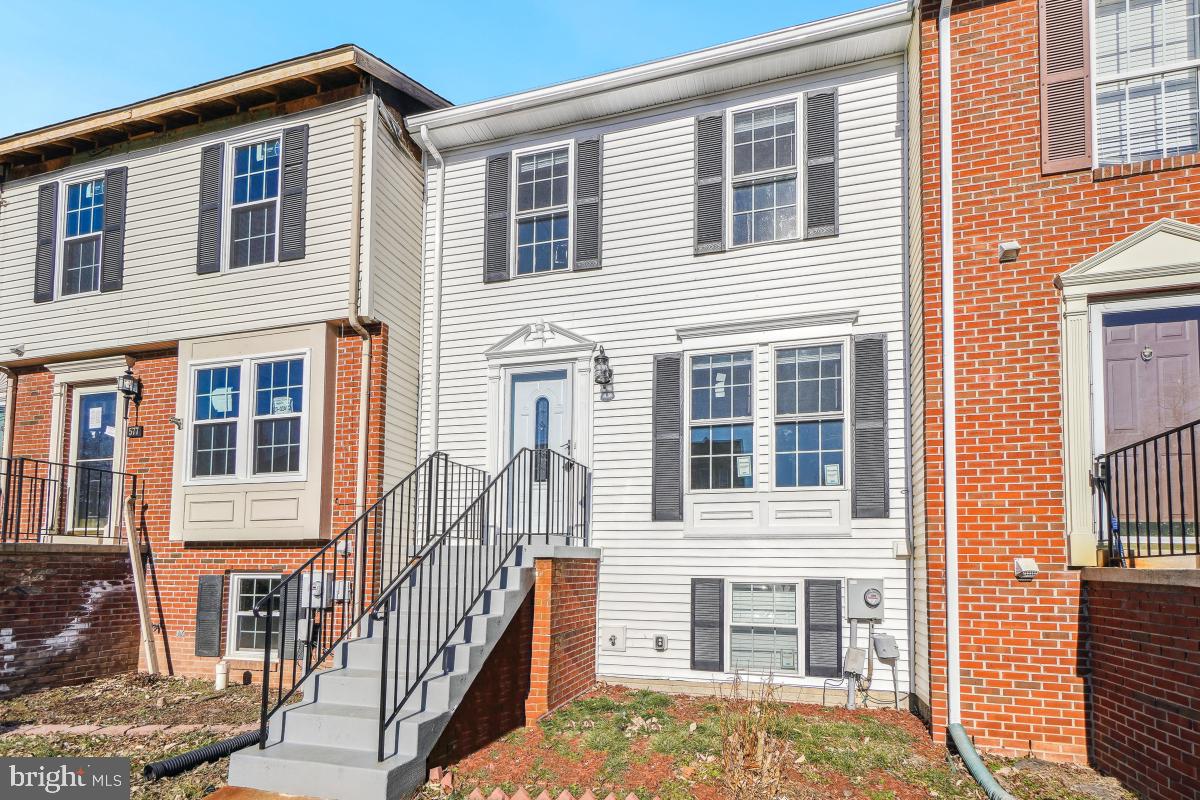 575 Primus Court Frederick, MD 21703 - Photo 2 of 31 a front view of a house with a yard