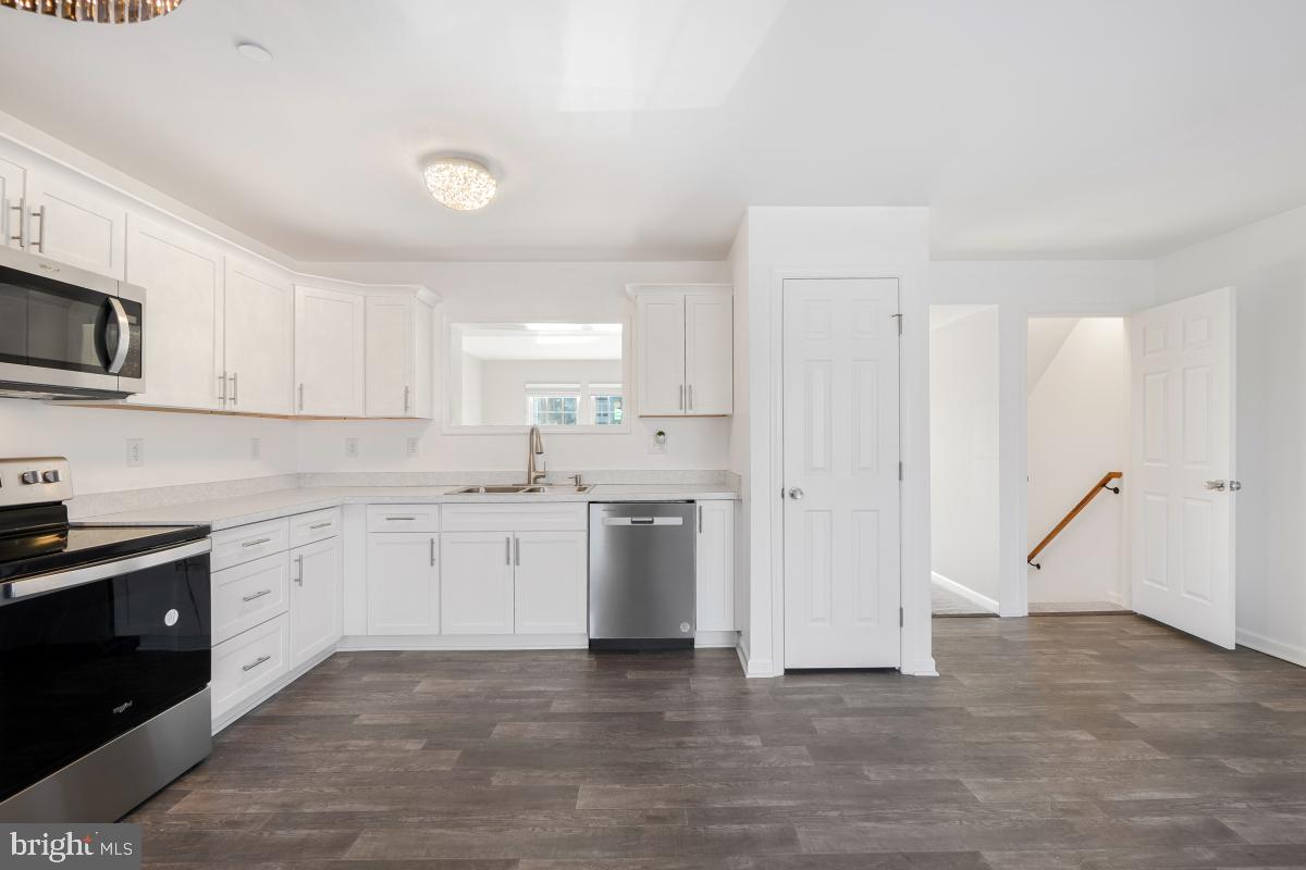 575 Primus Court Frederick, MD 21703 - Photo 24 of 31 a kitchen with appliances cabinets and a sink