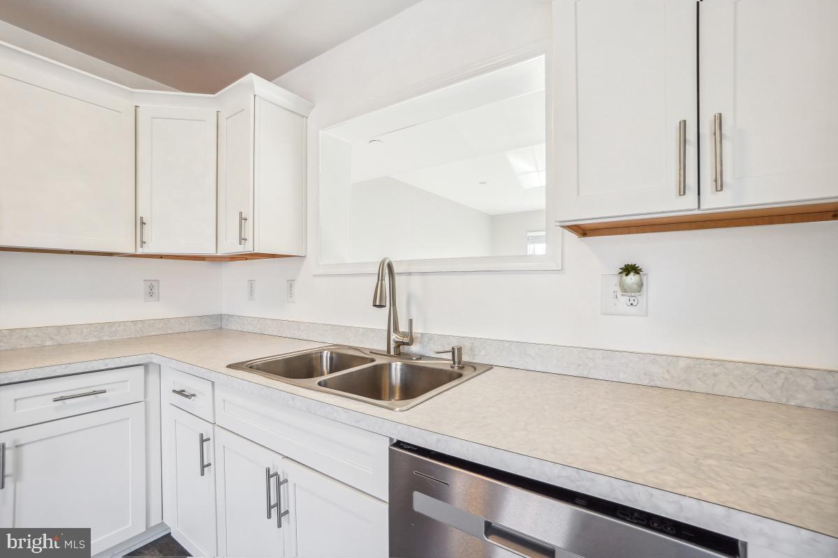 575 Primus Court Frederick, MD 21703 - Photo 25 of 31 a kitchen with a sink and cabinets
