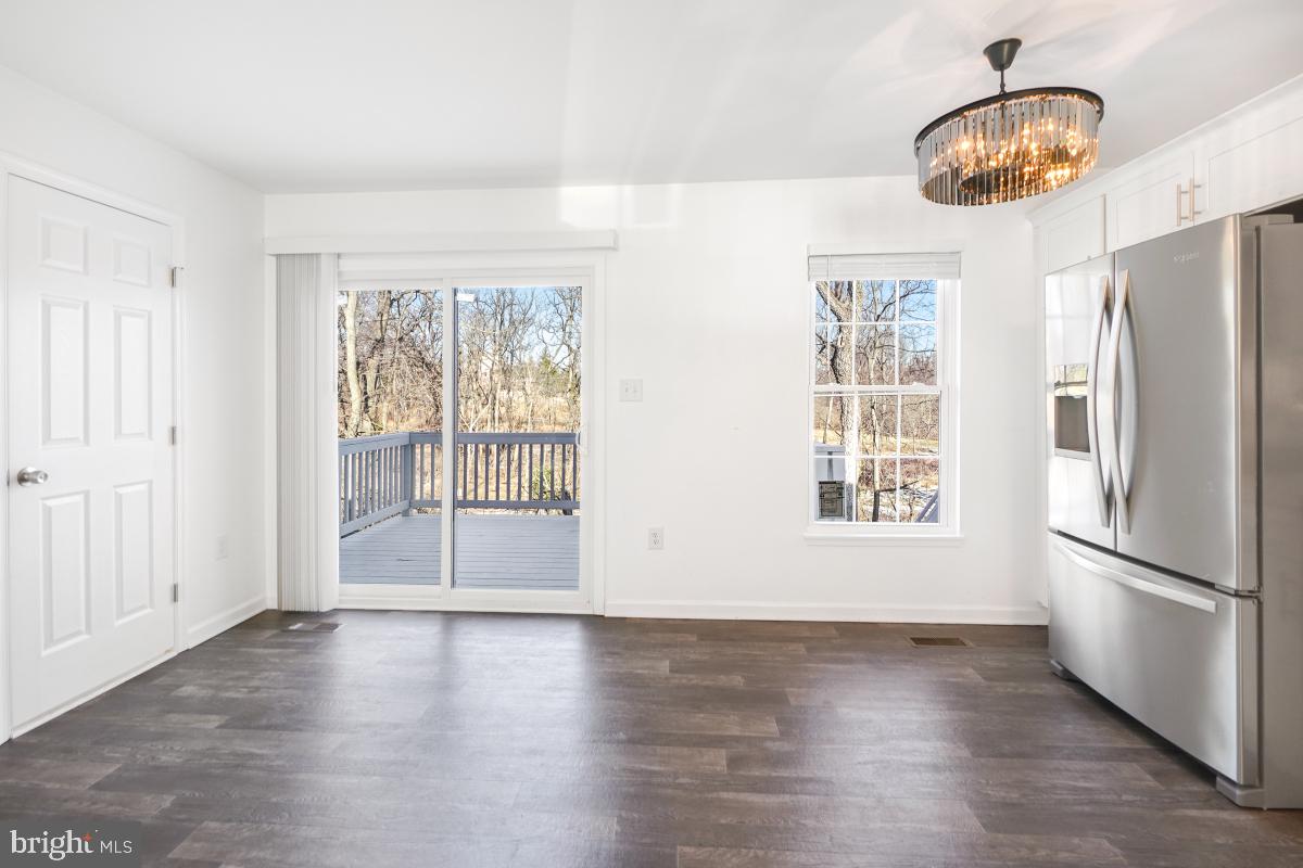 575 Primus Court Frederick, MD 21703 - Photo 26 of 31 a view of an empty room with wooden floor and a window
