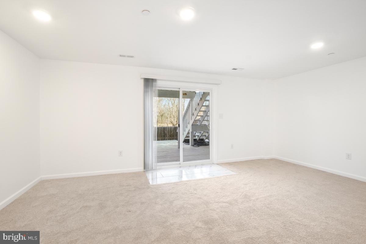 575 Primus Court Frederick, MD 21703 - Photo 27 of 31 an empty room with wooden floor and natural light