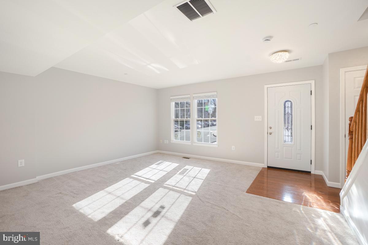 575 Primus Court Frederick, MD 21703 - Photo 7 of 31 an empty room with windows