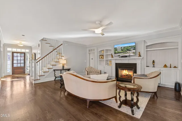 a kitchen with stainless steel appliances granite countertop a sink dishwasher stove and oven with wooden floor