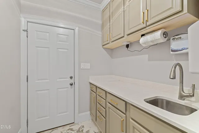 a kitchen with stainless steel appliances granite countertop a sink a stove and a wooden cabinets