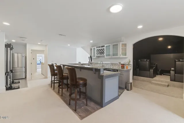 a view of a swimming pool with an outdoor seating