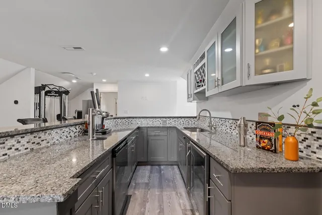 a view of a house with a backyard and a patio