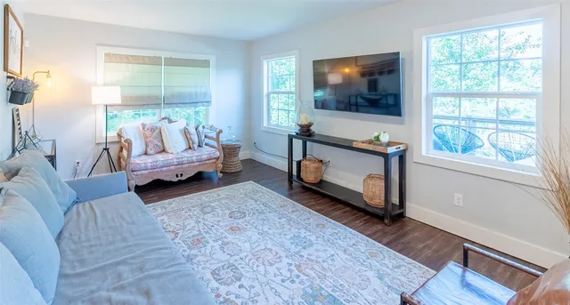 a view of a hallway with a chandelier fan