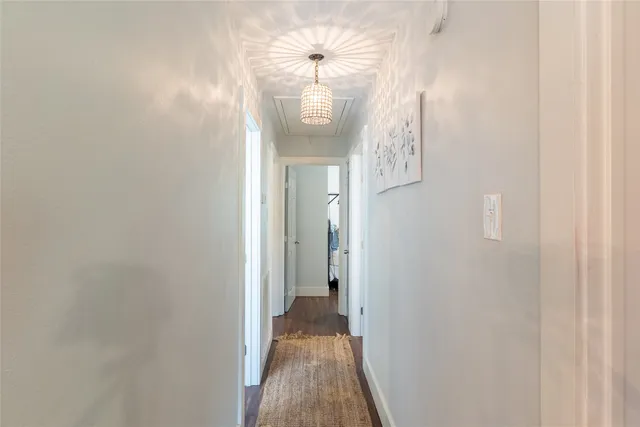 a bathroom with a granite countertop toilet a sink and a mirror