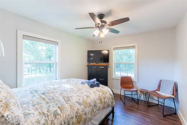 a bedroom with a bed and window