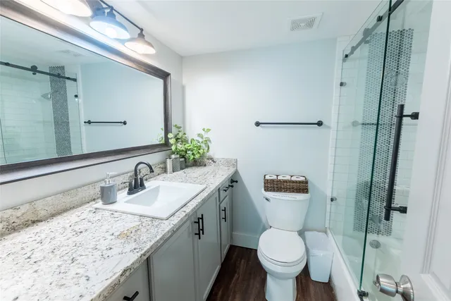 a view of balcony with wooden floor