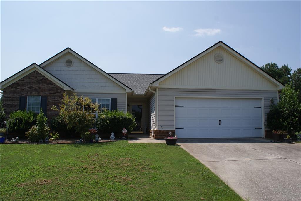 211 Lucas Way Statham, GA 30666 - Photo 1 of 1 a front view of house with yard and green space