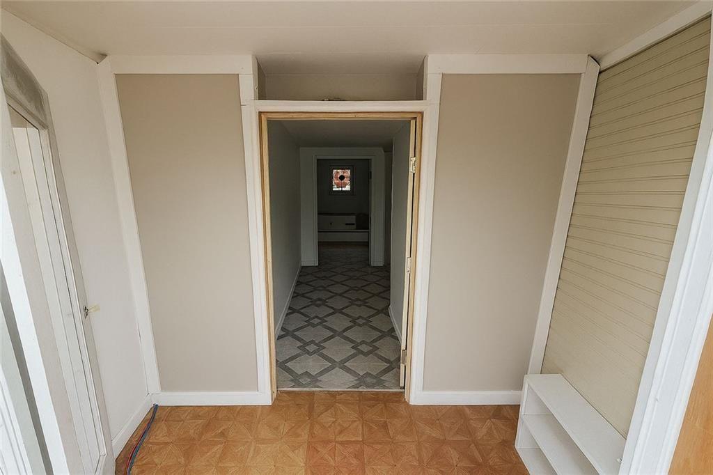 209 Old Perry Road Marshallville, GA 31057 - Photo 40 of 40 a view of a hallway with wooden floor and staircase