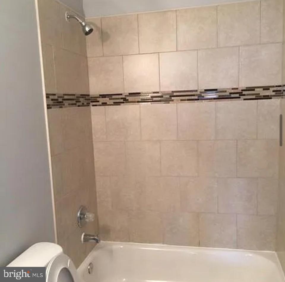 2023 West Lexington Street Baltimore, MD 21223 - Photo 2 of 10 a bathroom with a shower and a toilet