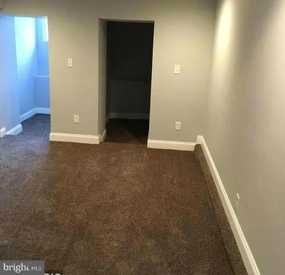 2023 West Lexington Street Baltimore, MD 21223 - Photo 4 of 10 an empty room with closet