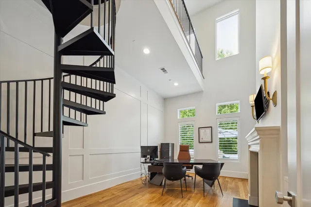 a kitchen with granite countertop a sink a stove and cabinets