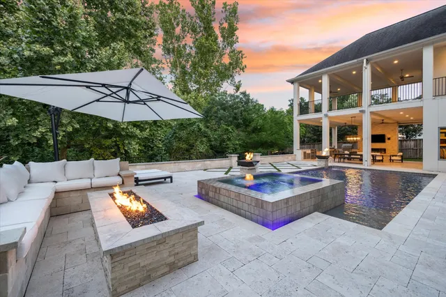 a outdoor living space with furniture and a fireplace