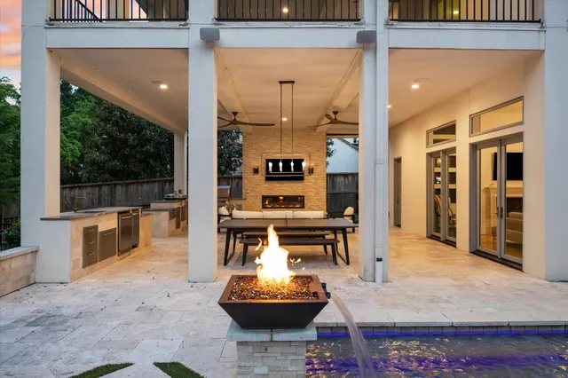 swimming pool view with a seating space