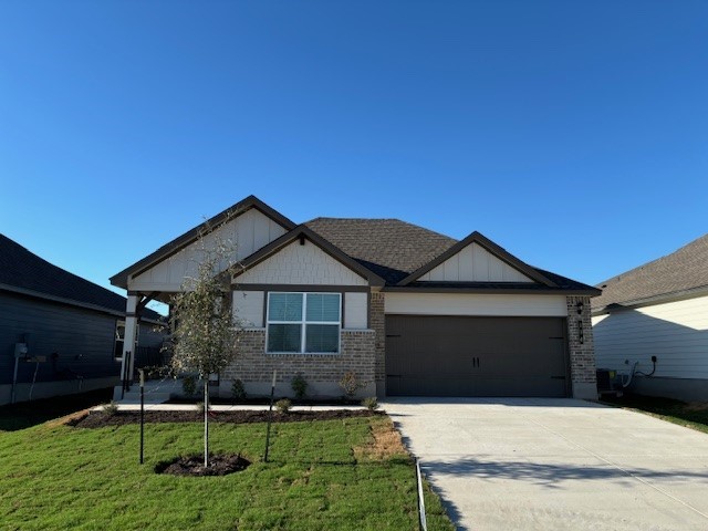 104 Watch Hill Jarrell, TX 76537 - Photo 1 of 1 a front view of a house with garden
