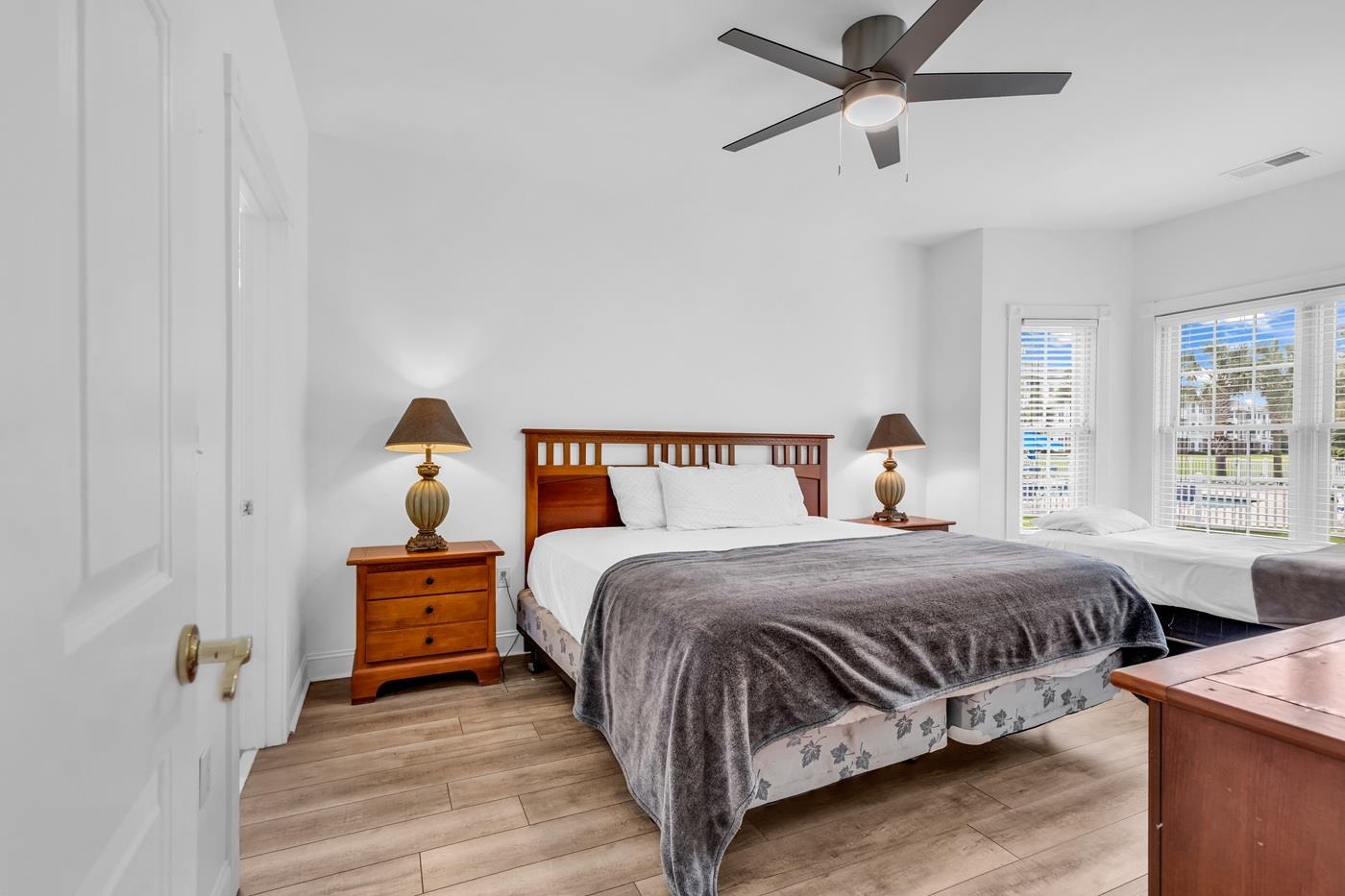 4801 Luster Leaf Circle, Unit 104 Myrtle Beach, SC 29577 - Photo 18 of 37 Bedroom with light wood-type flooring and ceiling fan