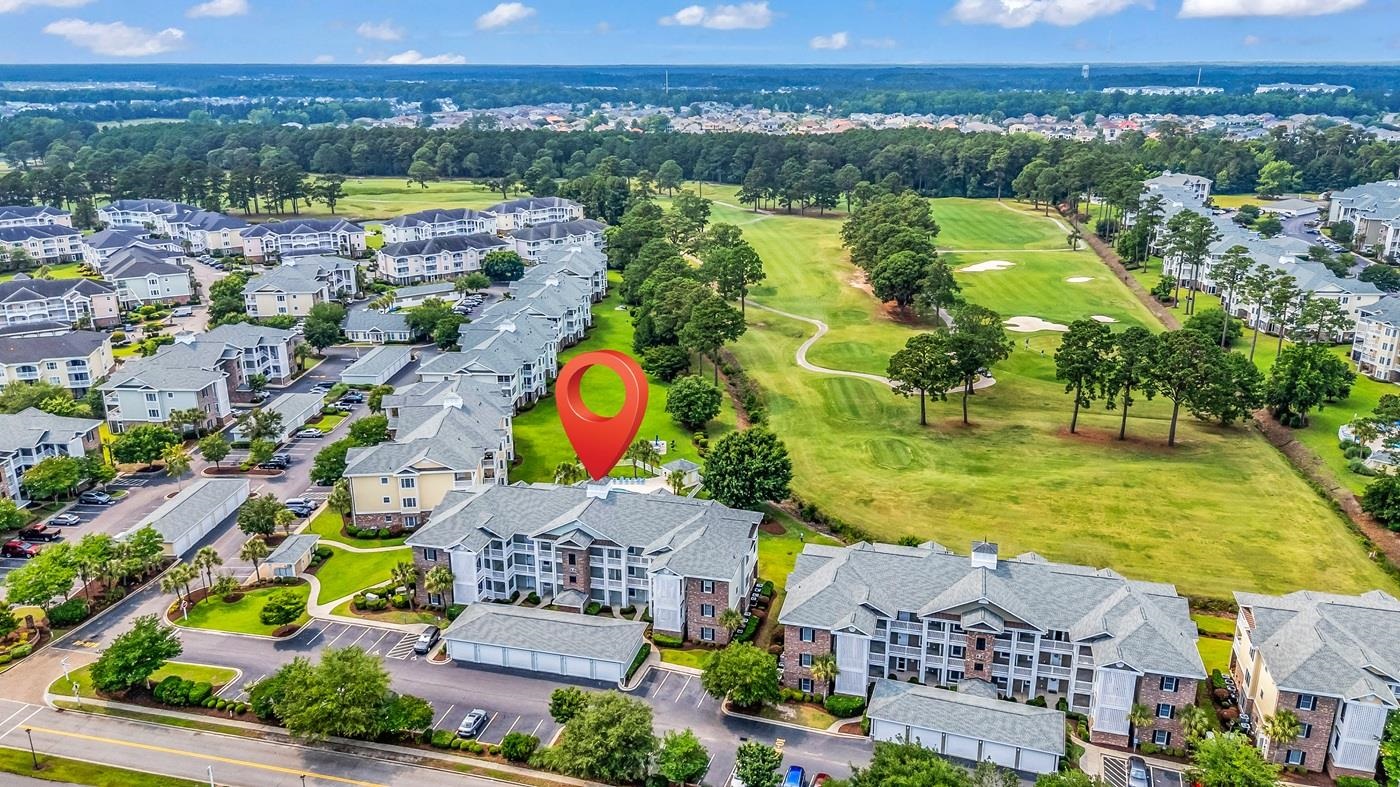 4801 Luster Leaf Circle, Unit 104 Myrtle Beach, SC 29577 - Photo 29 of 37 Aerial view of residential area with a golf course