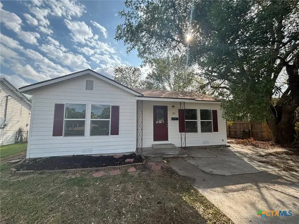a front view of a house with yard