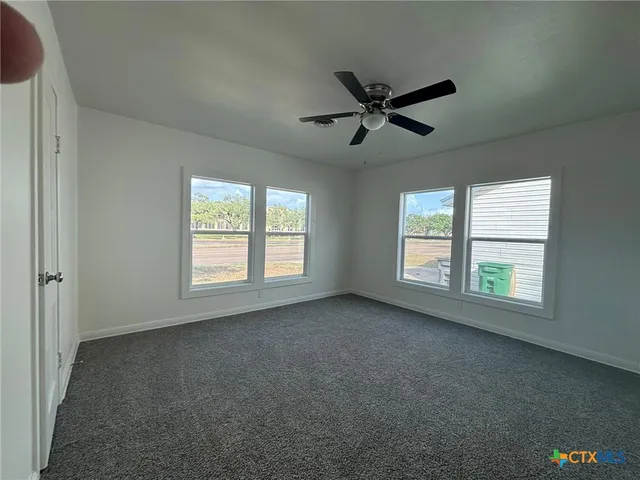 a view of empty room with windows