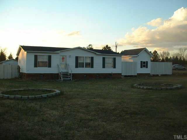 877 Garner Road Selma, NC 27576 - Photo 1 of 1 Privacy Fence in Front Yard and Wood Fence on three Sides From the House to the Back