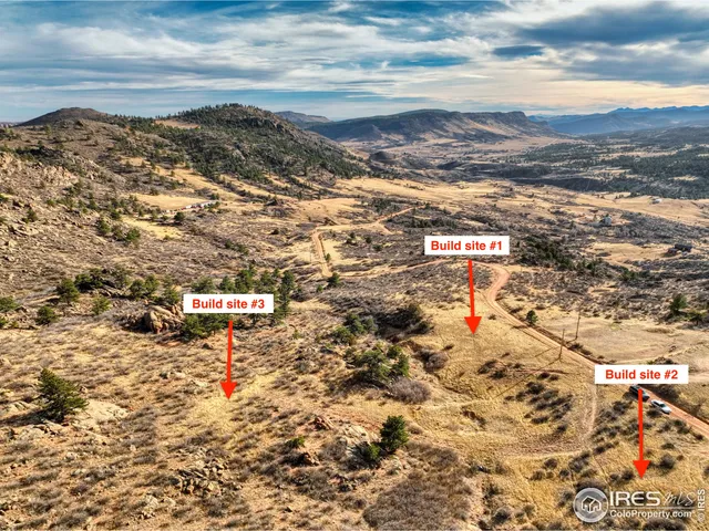 a view of a town with mountains in the background