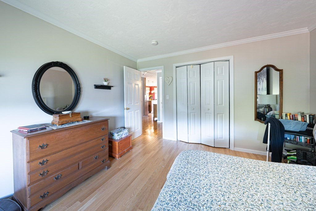 15 Fox Run Road, Unit 15 Blackstone, MA 01504 - Photo 12 of 22 a bedroom with a bed and a dresser