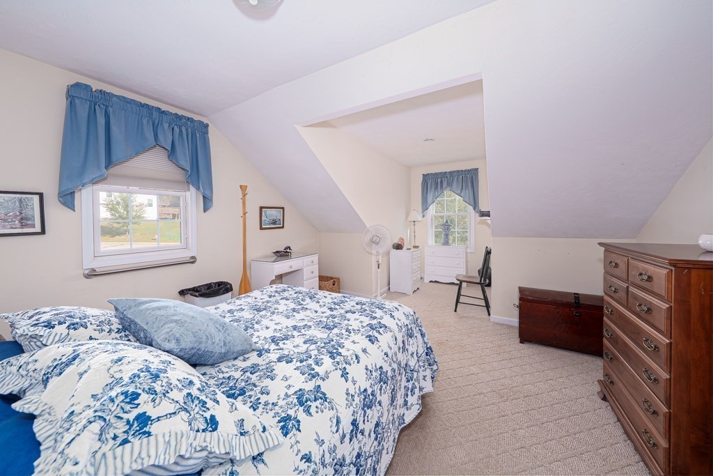 15 Fox Run Road, Unit 15 Blackstone, MA 01504 - Photo 16 of 22 a bedroom with a bed and a dresser