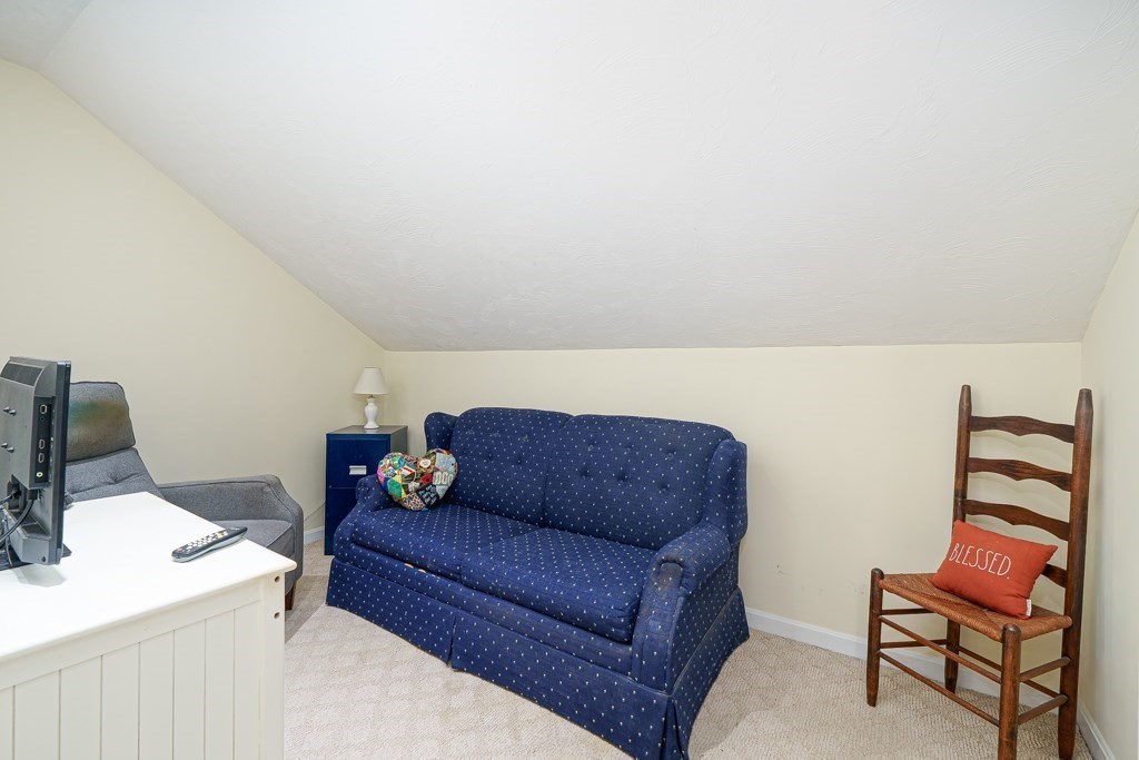 15 Fox Run Road, Unit 15 Blackstone, MA 01504 - Photo 17 of 22 a living room with furniture and a couch