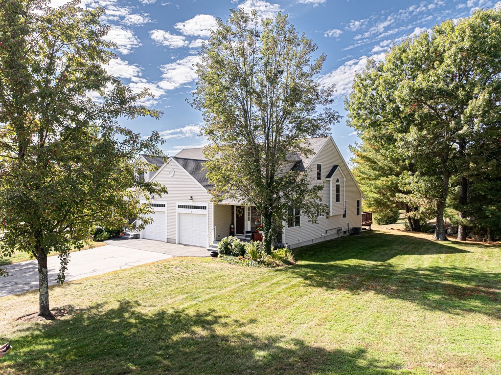 15 Fox Run Road, Unit 15 Blackstone, MA 01504 - Photo 2 of 22 a view of a house with a yard and large tree