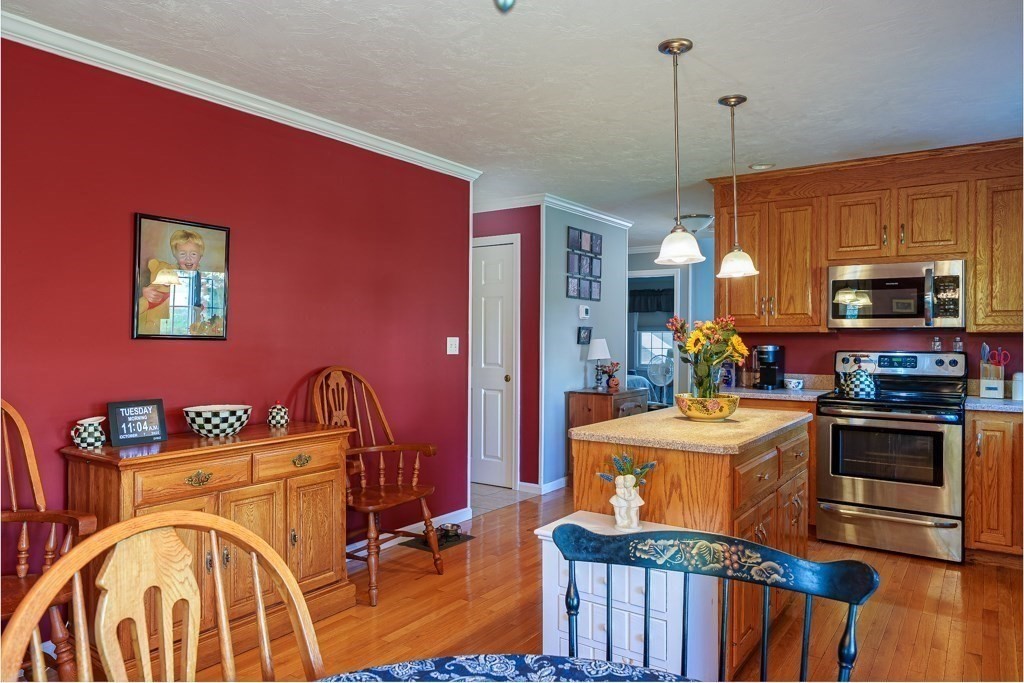 15 Fox Run Road, Unit 15 Blackstone, MA 01504 - Photo 7 of 22 a dining room with furniture and wooden floor