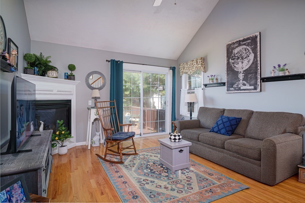 15 Fox Run Road, Unit 15 Blackstone, MA 01504 - Photo 9 of 22 a living room with furniture and a fireplace