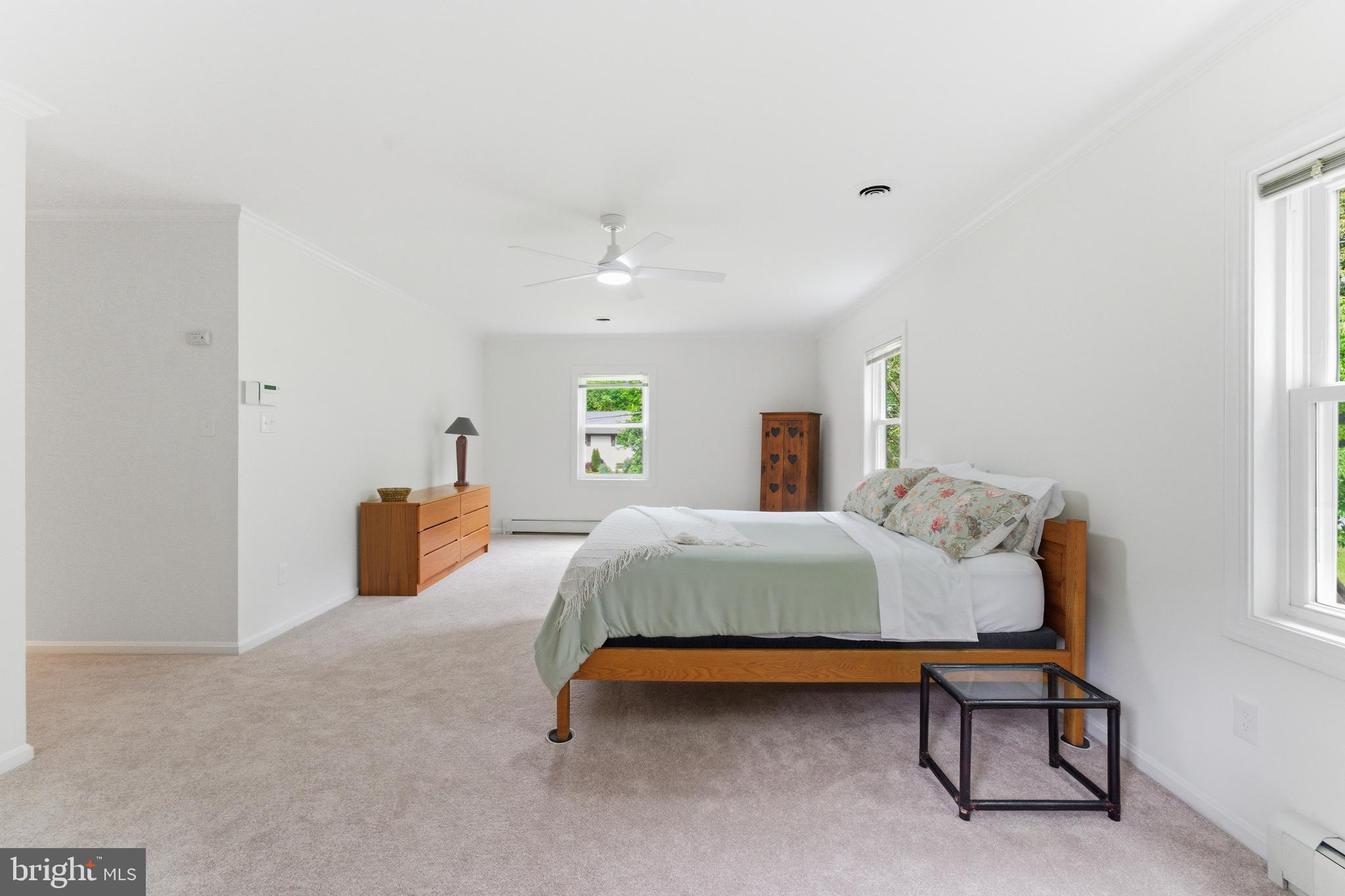 2100 Edgewater Parkway Silver Spring, MD 20903 - Photo 30 of 46 a bedroom with a bed and a lamp