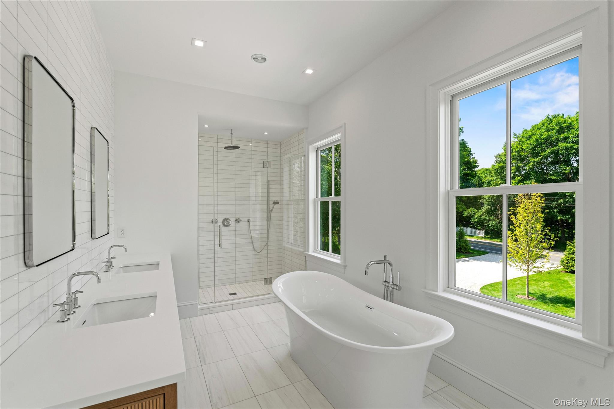 161 South Road Westhampton, NY 11977 - Photo 13 of 34 a bathroom with a sink and a large mirror