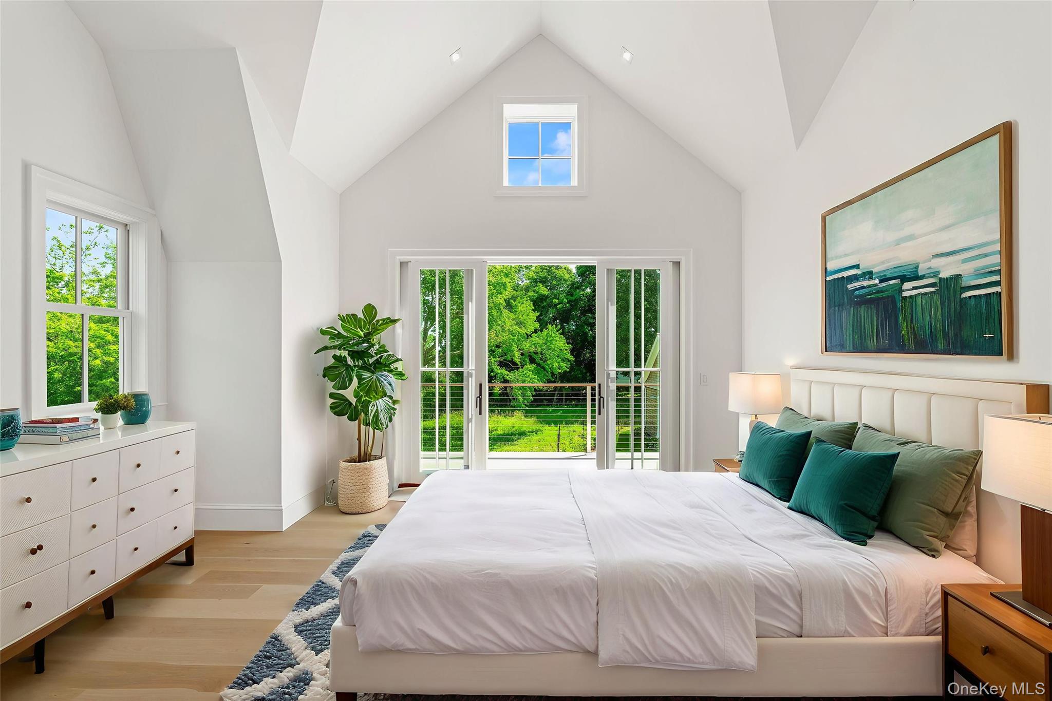 161 South Road Westhampton, NY 11977 - Photo 21 of 32 a bedroom with a bed and a window