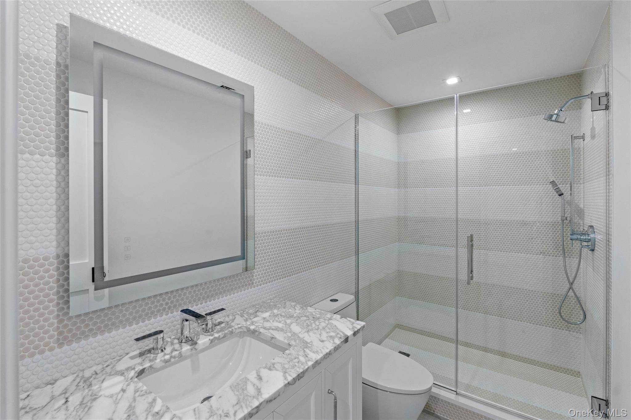 161 South Road Westhampton, NY 11977 - Photo 23 of 34 a bathroom with a granite countertop sink a toilet and shower