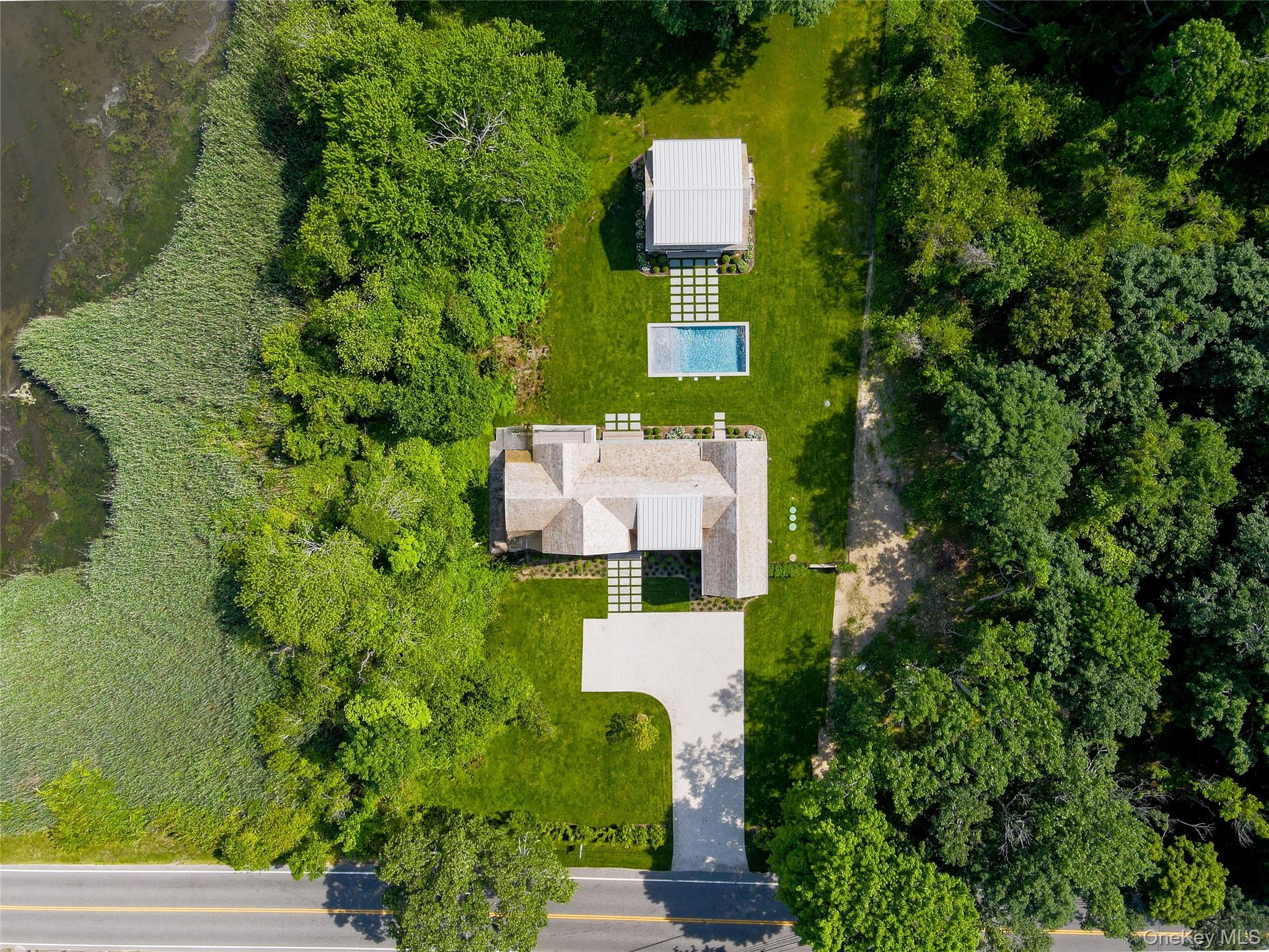 161 South Road Westhampton, NY 11977 - Photo 24 of 32 an aerial view of a house with a yard