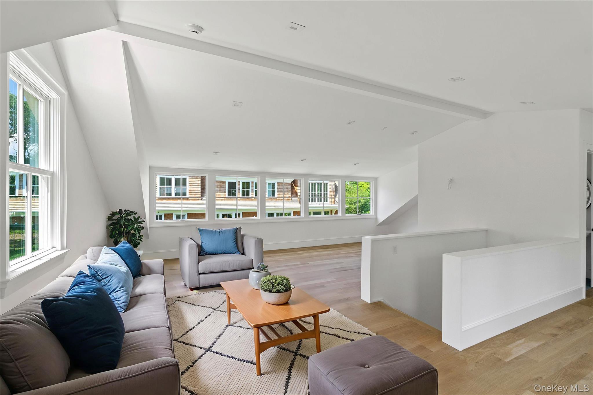 161 South Road Westhampton, NY 11977 - Photo 27 of 32 a living room with furniture and a wooden floor