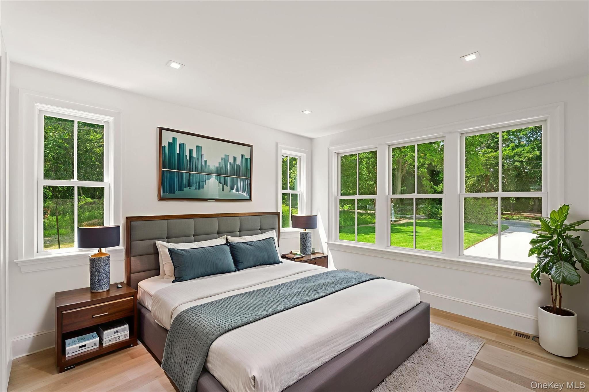 161 South Road Westhampton, NY 11977 - Photo 29 of 34 a bedroom with a large bed and a large window